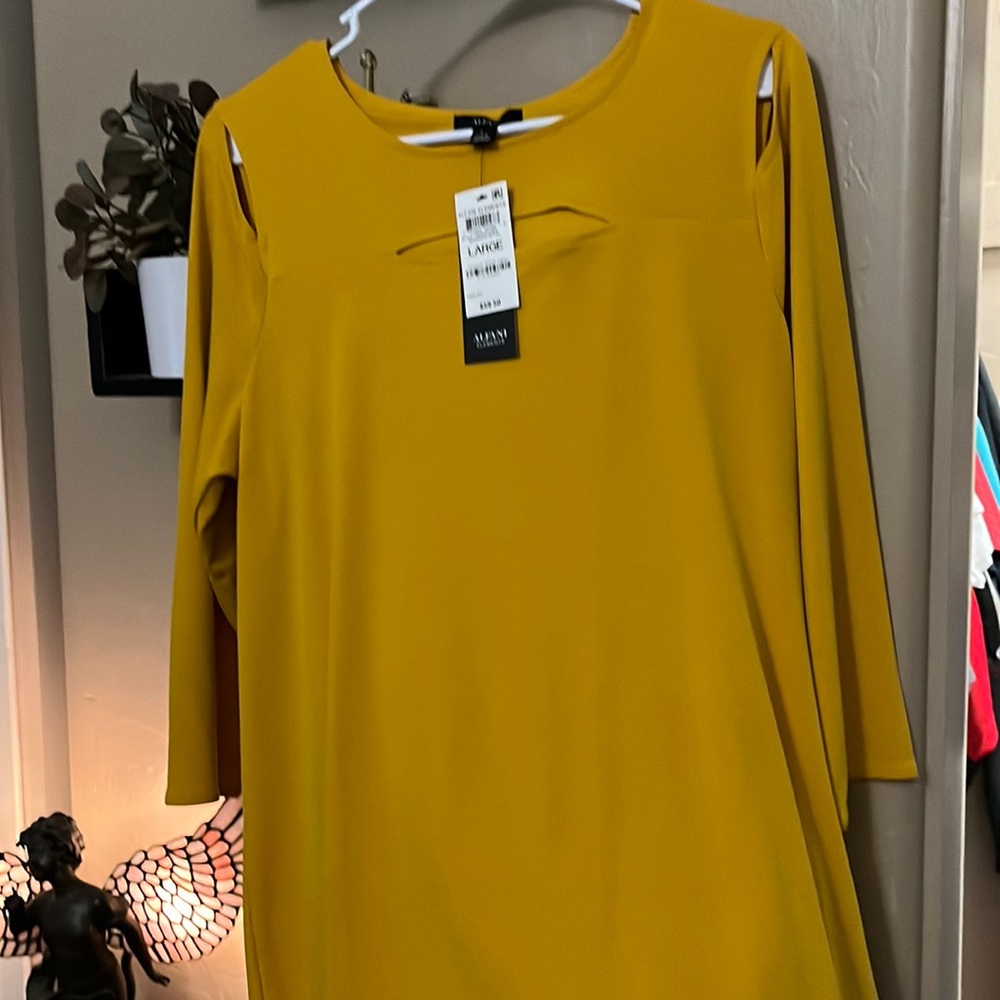 Mustard colored mid sleeve with cut outs